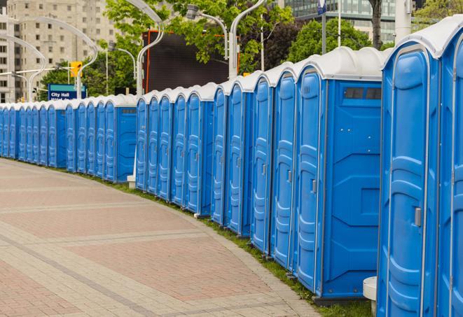 a row of portable restrooms at a fairground, offering visitors a clean and hassle-free experience in Avenel